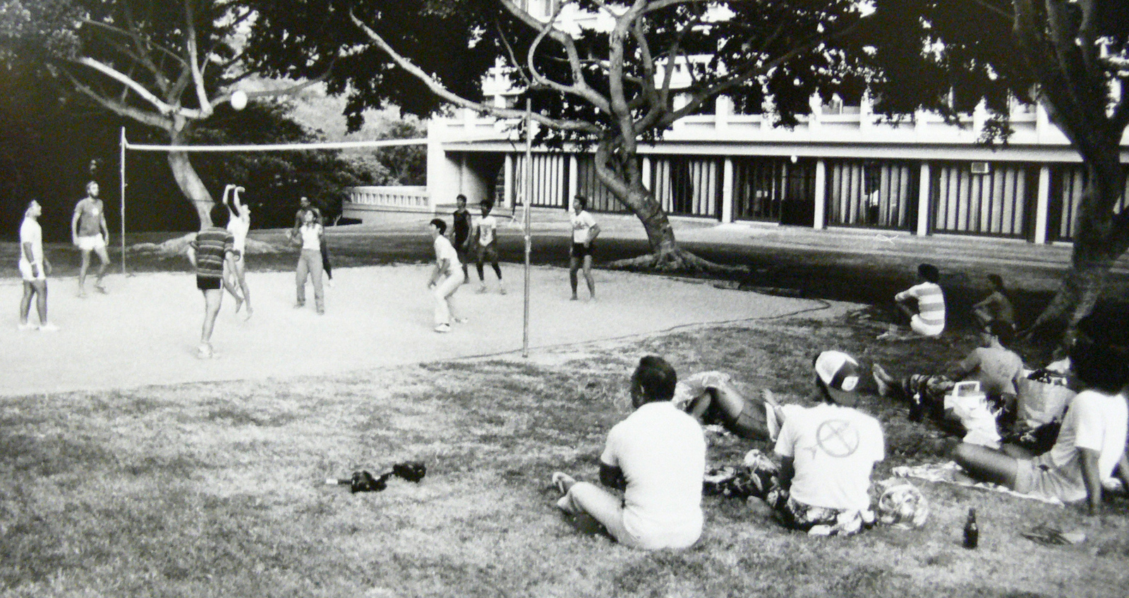 Students playing volleyball, black and white photo